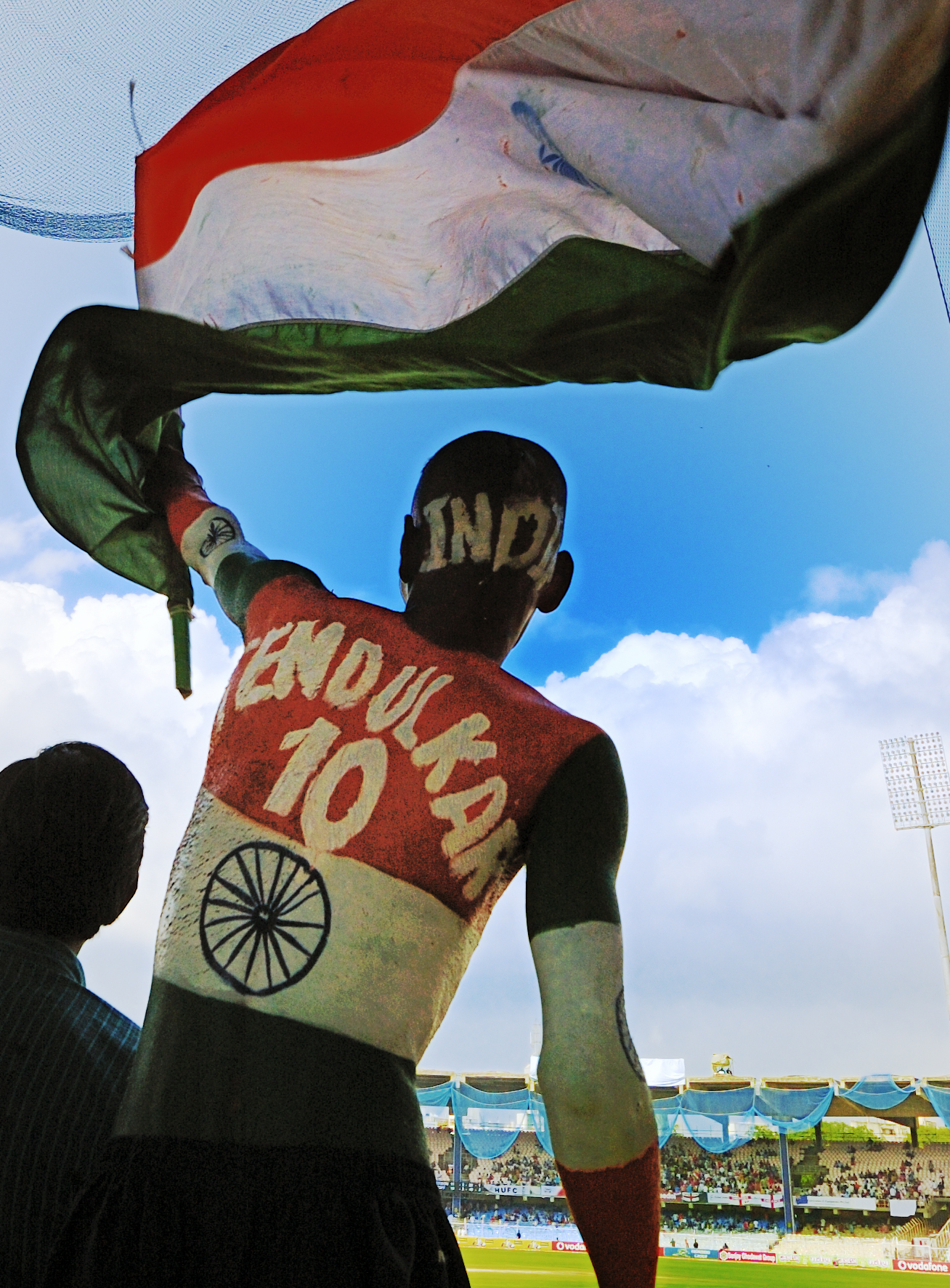 A cricket fan in the stands at Chepauk stadium