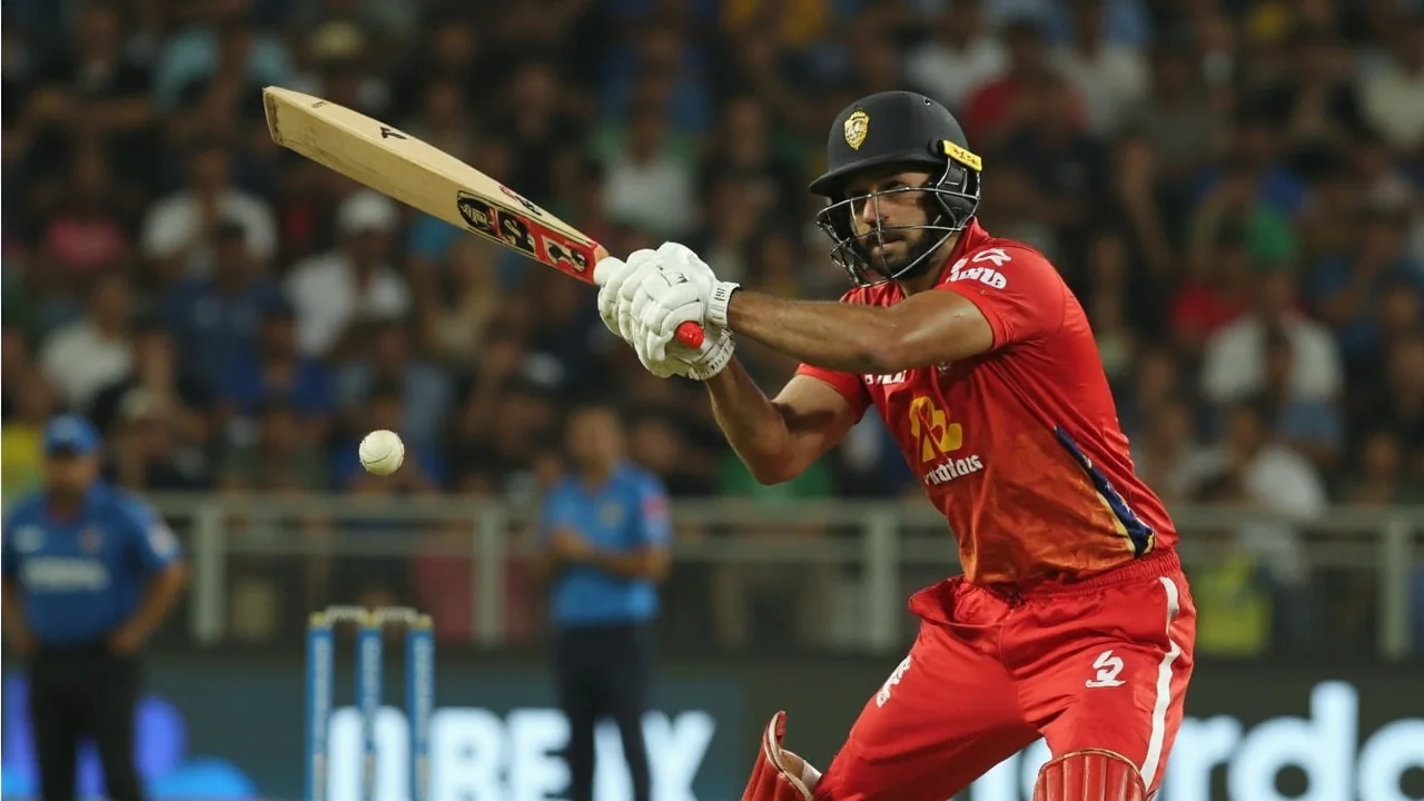 Tight sideline action frame of a young left-handed batter playing an attacking shot during a T20I, shot at 200mm with shallow depth of field