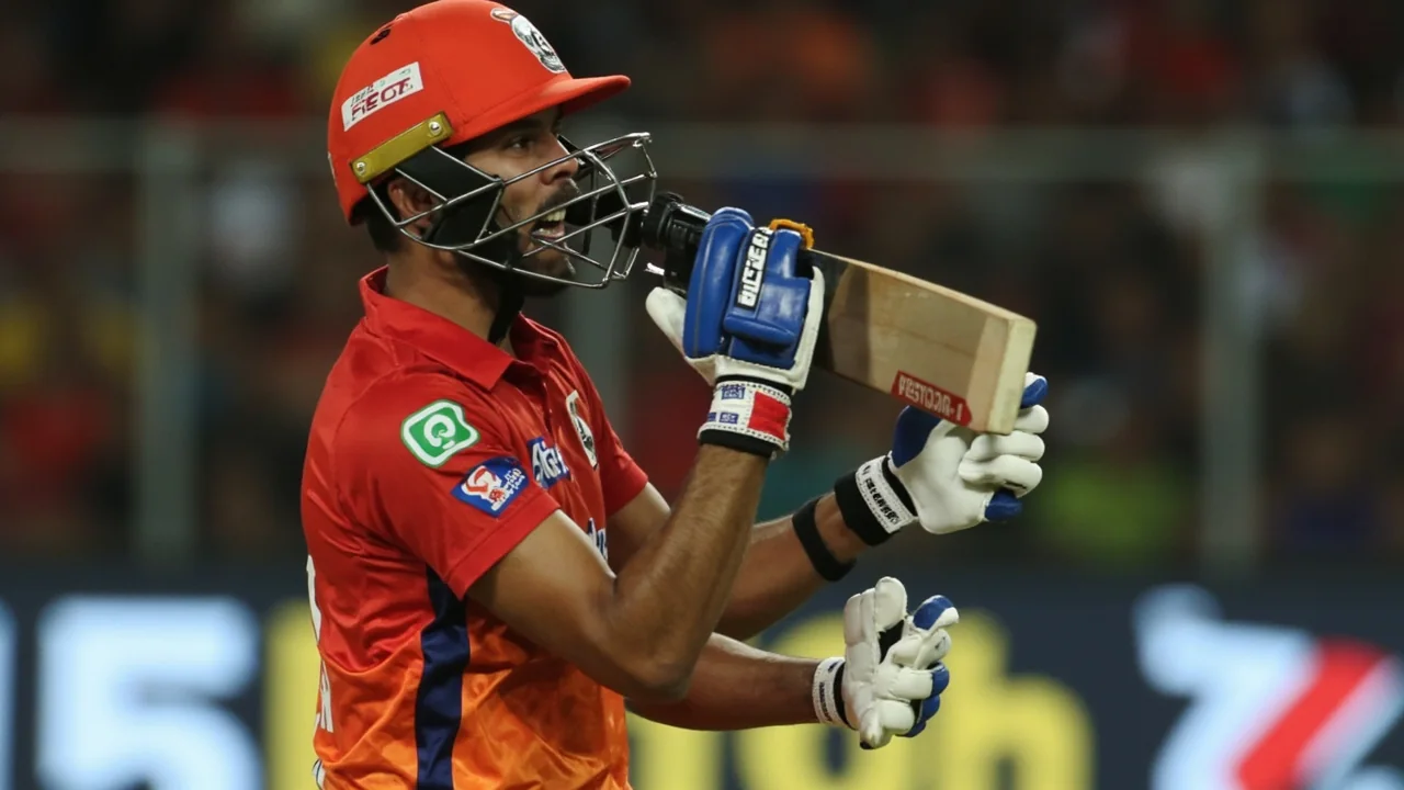 Tight sideline frame of a young top-order batter driving through the leg side at Sawai Mansingh Stadium, captured at 200mm with shallow depth of field and the crowd blurred behind the rope