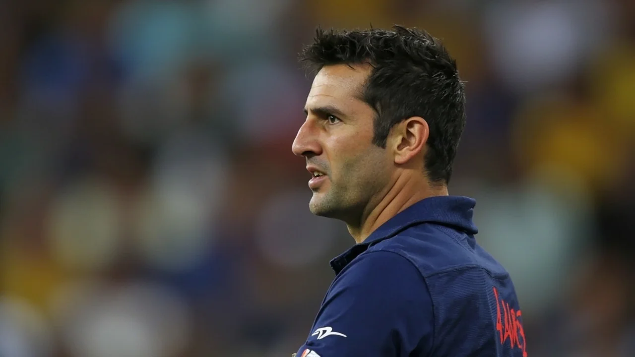 Tight sideline view of a Knight Riders coaching box during a T20 fixture, the dugout setting where the new Head of Cricket Strategy will spend match days alongside franchise head coaches